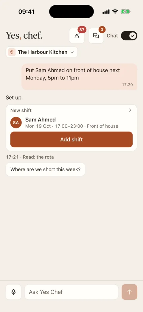 Chat mode on an iPhone: the request “Put Sam Ahmed on front of house next Monday, 5pm to 11pm”, the answer “Set up.”, and a New shift card for Sam Ahmed on Monday 19 October, 17:00 to 23:00, Front of house, with an Add shift button.