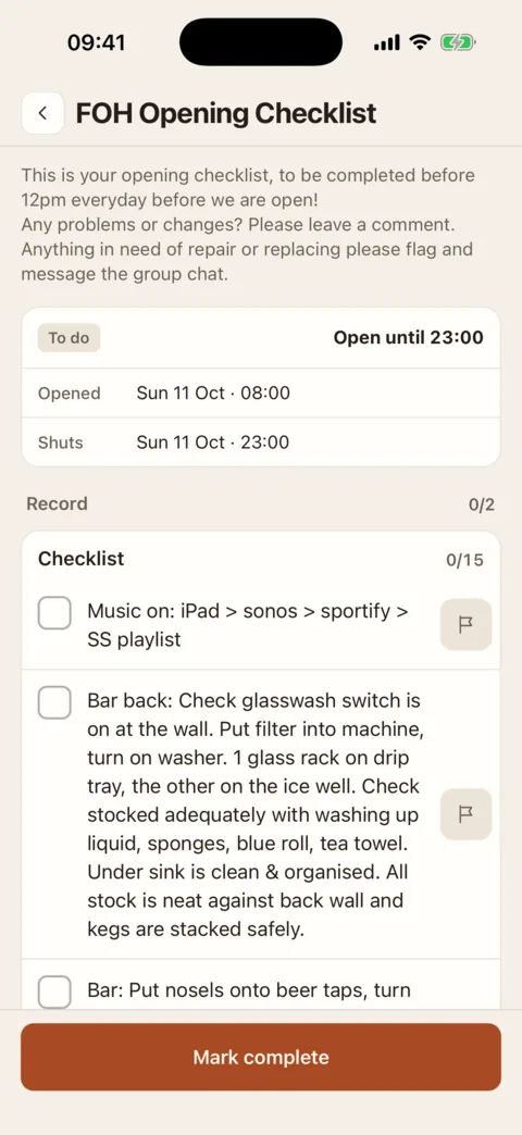 An opening checklist on an iPhone: marked To do and open until 23:00, with a list of fifteen items to tick and a Mark complete button at the foot.